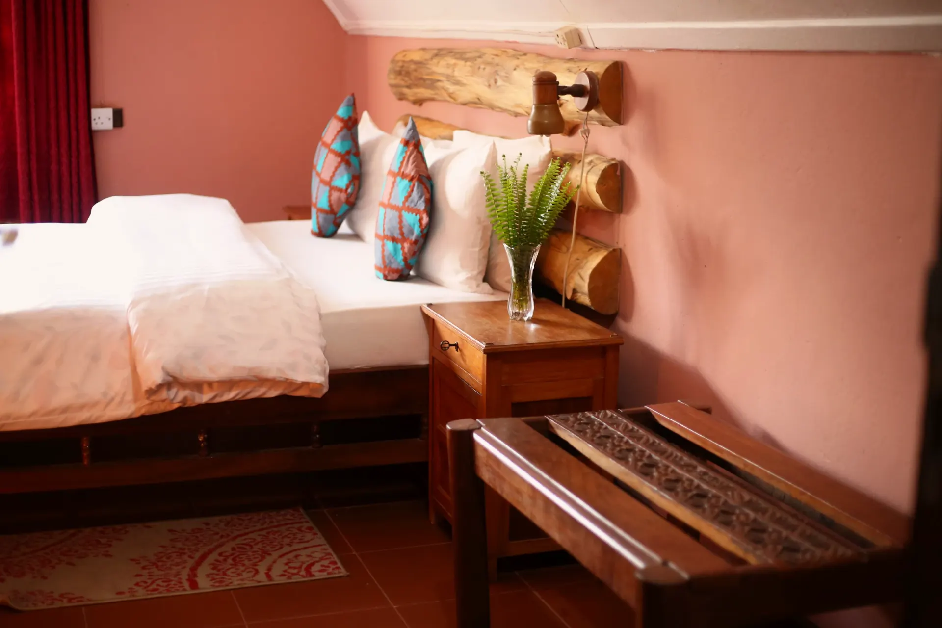 The first main-house bedroom at Mullers, dressed in warm linen
